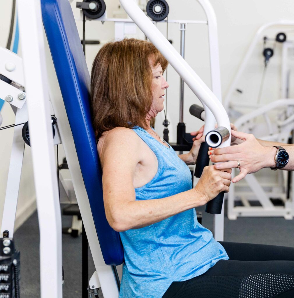 Stable machine exercises like this chest press are one of the best options for those with Ehlers Danlos