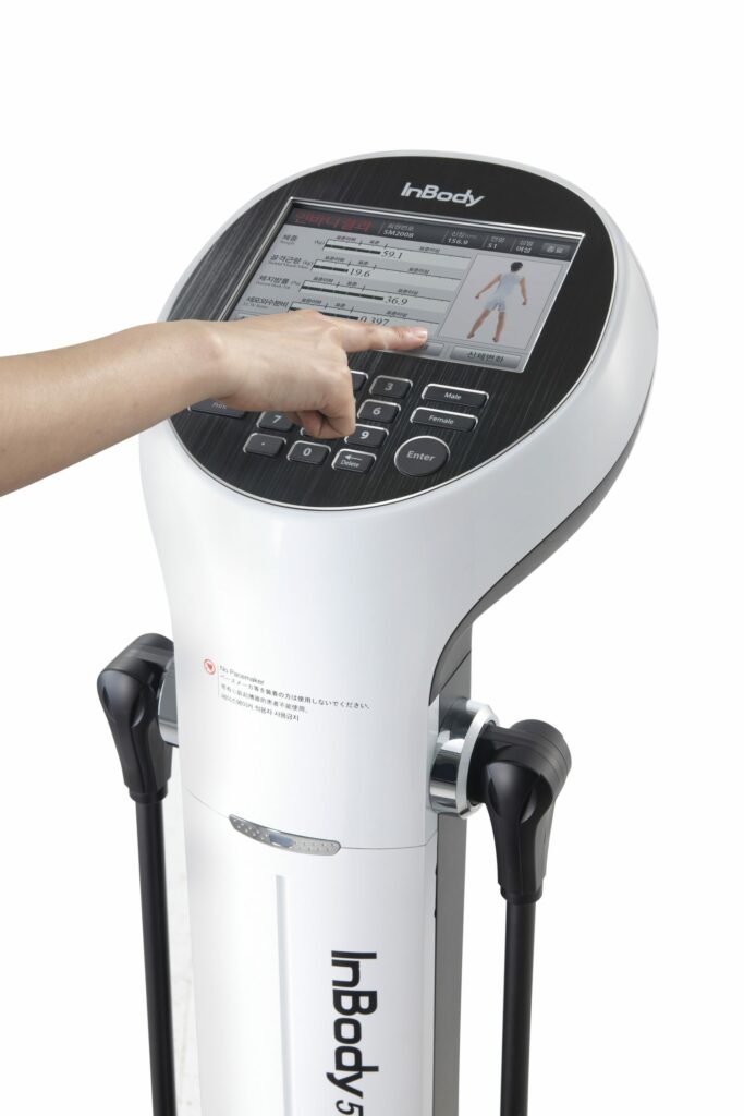The InBody 570 body composition analyzer shows visceral fat, lean muscle mass.